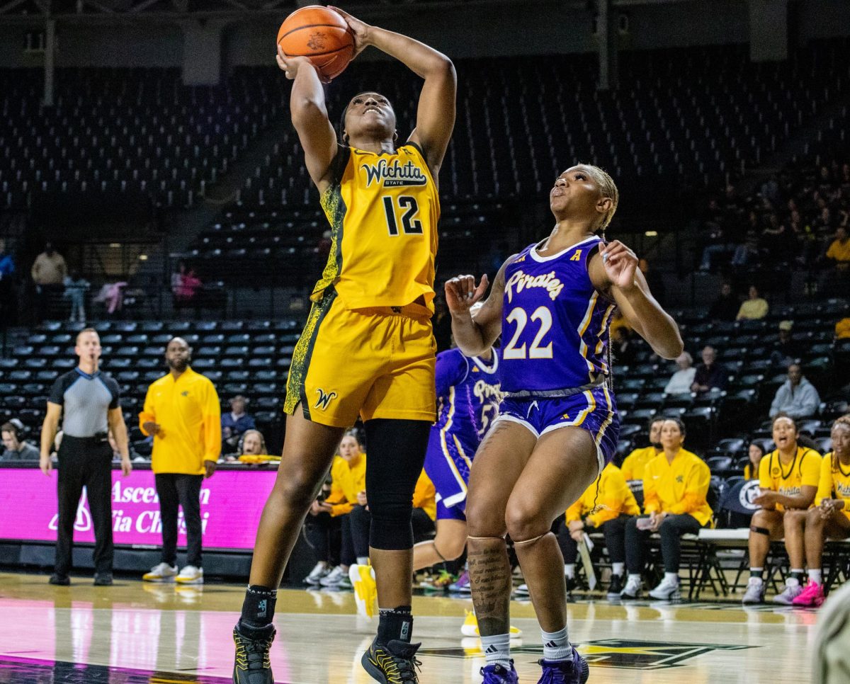 Wichita State women's basketball graduate forward Bre'Yon White (12) attempts a layup against East Carolina on Jan. 10. The Pirates beat the Shockers, 83-56.