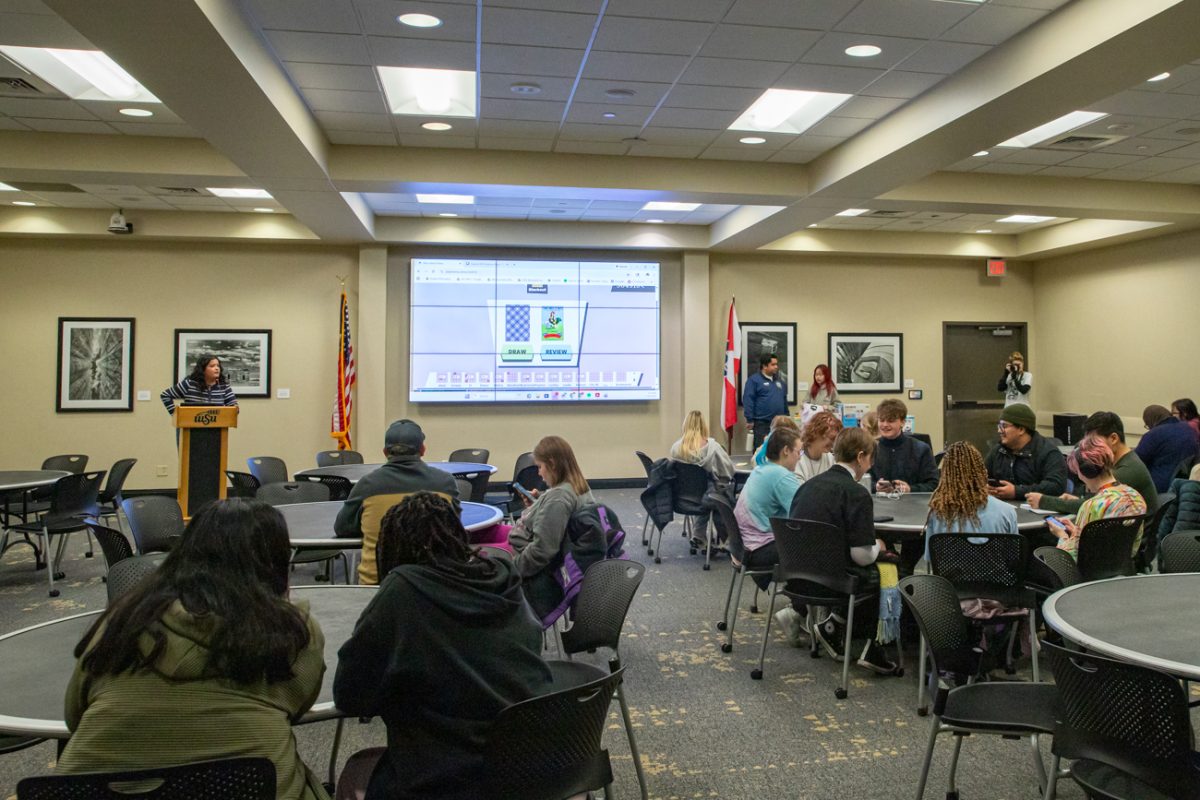 Students play lotería in the RSC. Students used their phones to play a digital version of the game.