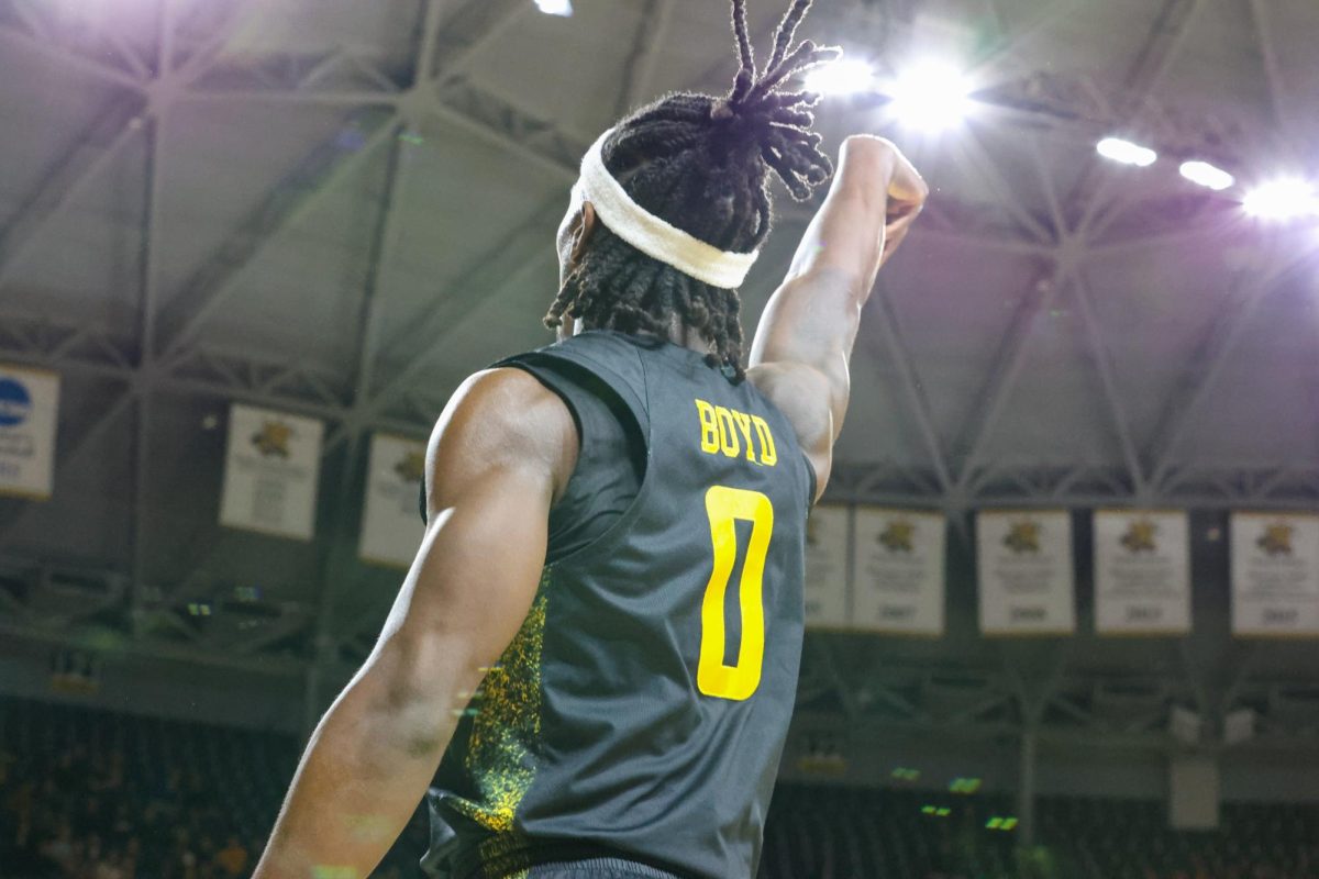 Wichita State men's basketball senior forward Karon Boyd (0) shoots a corner three against East Carolina on Jan. 21. The Shockers went 9-for-34 from beyond the arc.