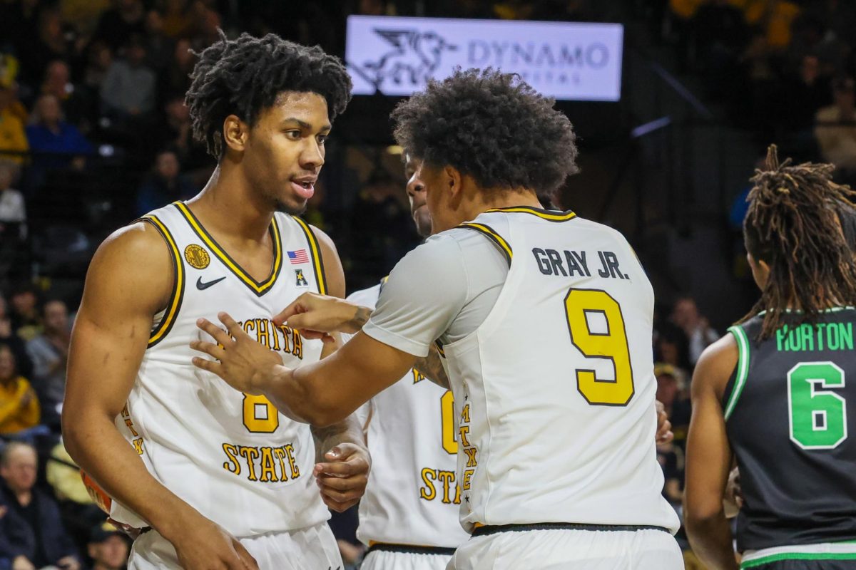 Wichita State basketball senior guard Mike Gray Jr. (9) hypes up sophomore forward Dillon Battie (8) against North Texas on Jan. 11, 2026. (File photo)