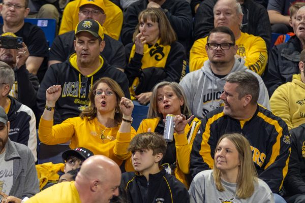 Shocker fans sing along to music during the pregame at the Reynolds Center in Tulsa before Wichita State's game against Tulsa Feb. 1. The Shocker faithful filled most of Section 106, and were scattered in Sections 105, 113 and 114, among others.