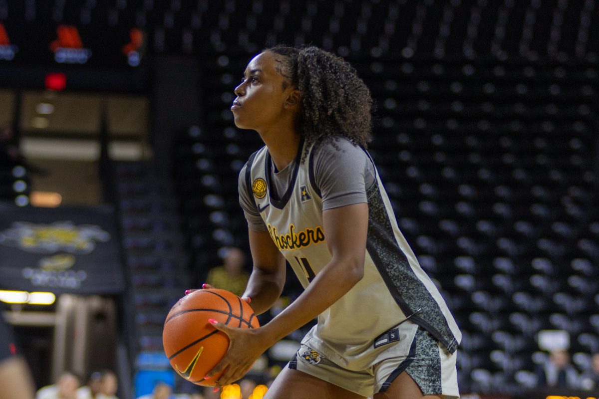 Wichita State women's basketball graduate guard Jaila Harding (4) begins her shooting motion against Tulsa on Feb. 3. Harding scored a Division I career-high 24 points against the Golden Hurricane.