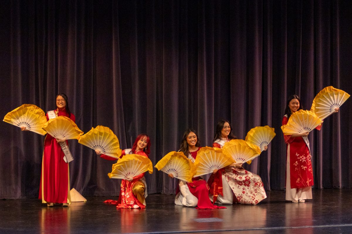 The Miss Vietnam Wichita court dances with their fans at the VSA Lunar New Year celebration. The event took place on Saturday evening.