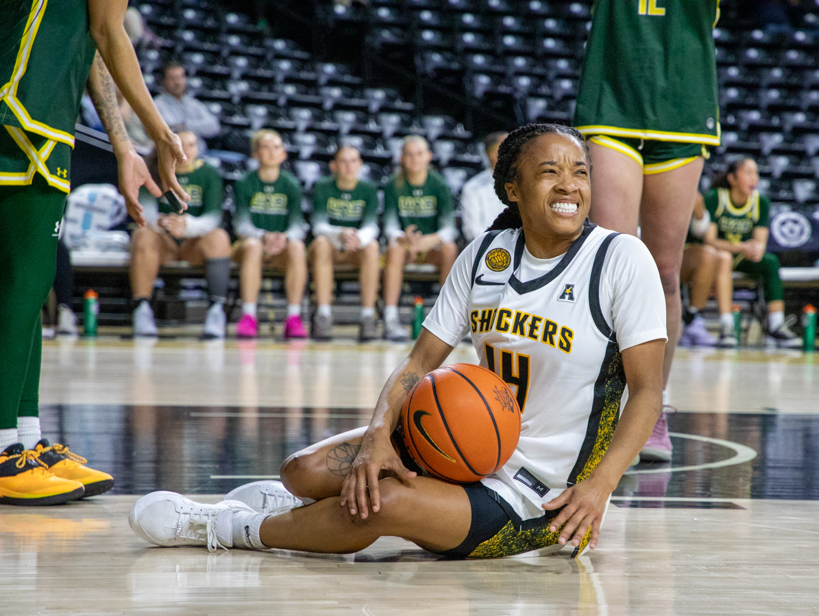 Wichita State women's basketball graduate guard Taya Davis (14) winces after being fouled against UAB on Jan. 31. (File photo)