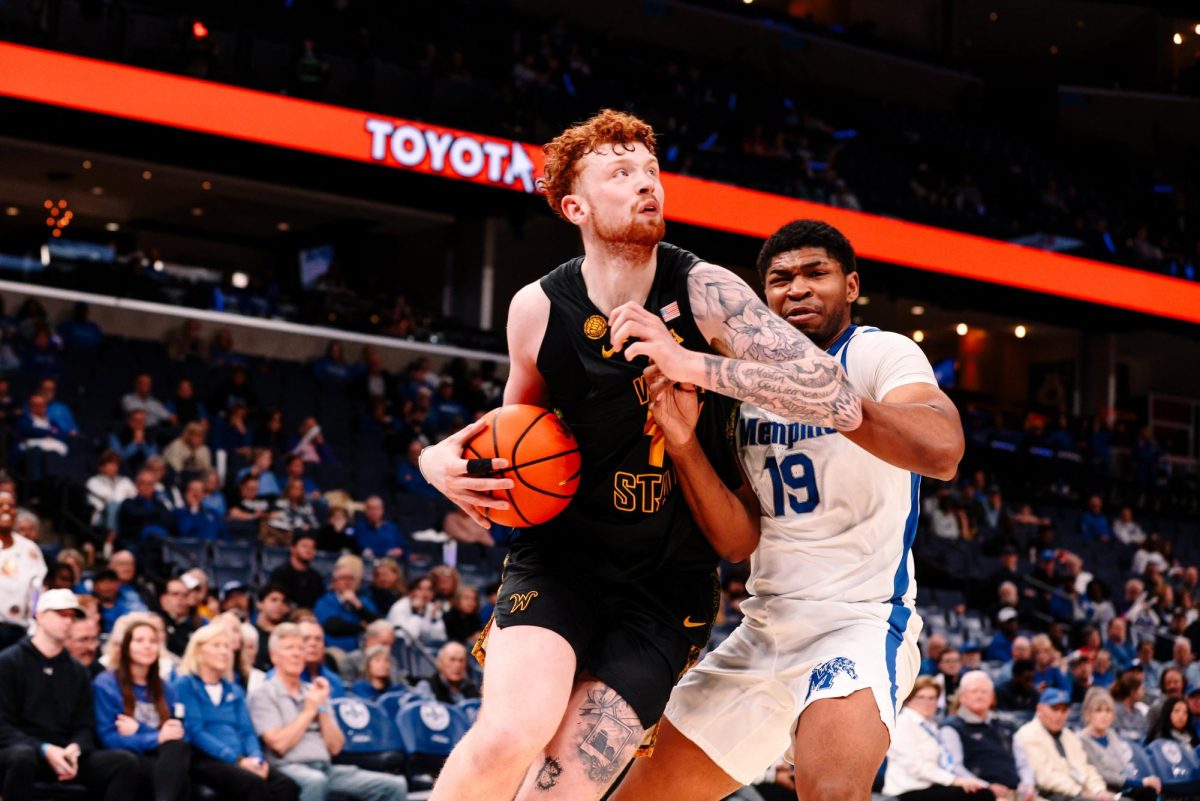 Wichita State men's basketball junior center Will Berg (44) bullies his way into the paint against Memphis on Feb. 26 at FedExForum in Memphis, Tenn. (Photo courtesy of Wichita State Athletics)
