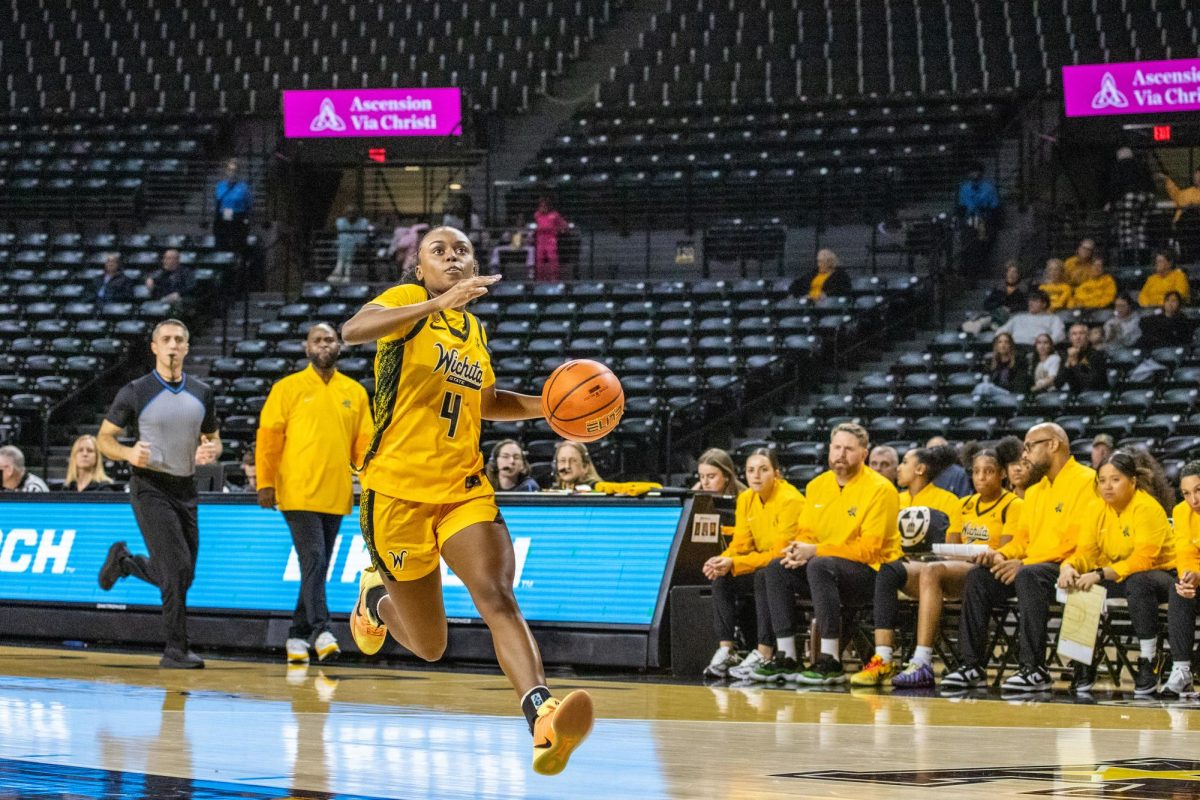 Wichita State women's basketball graduate guard Jaila Harding (4) takes the ball for a layup on Jan. 10. (File photo)