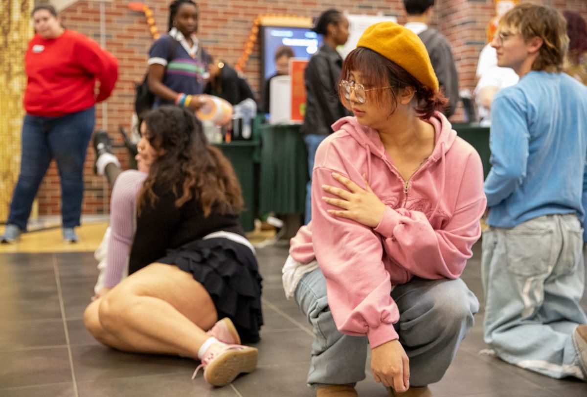 Van Ang Nguyen looks towards the ground in an opening dance pose on Feb. 10. Nguyen performed with Dream Team, a K-pop and hip-hop dance group based in Wichita.
