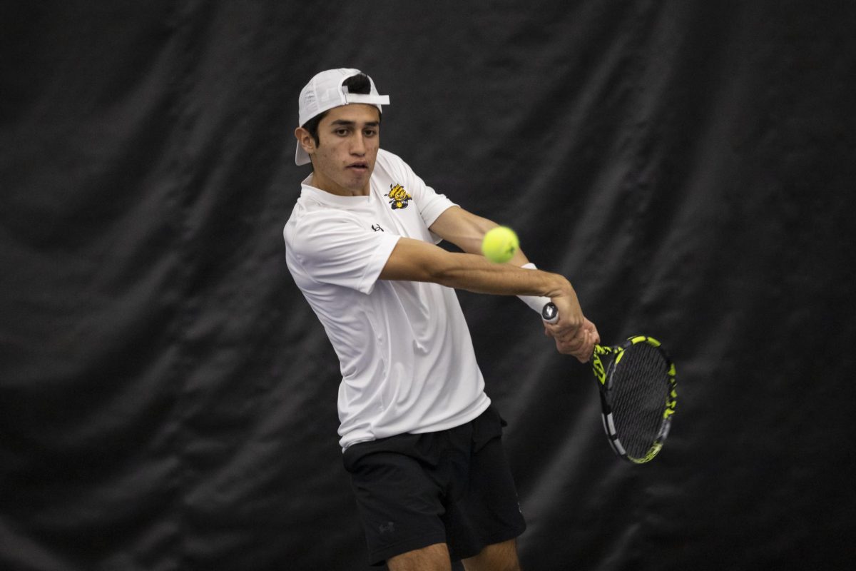 Wichita State men's tennis player Alejandro Jacome prepares to hit the ball during a singles match against Drake on Jan. 26, 2025. (File photo)