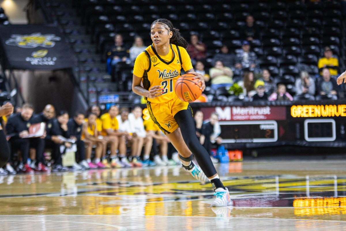 Wichita State women's basketball graduate forward Treasure Thompson (21) dribbles down the court during a game at Koch Arena earlier this season. (File photo)