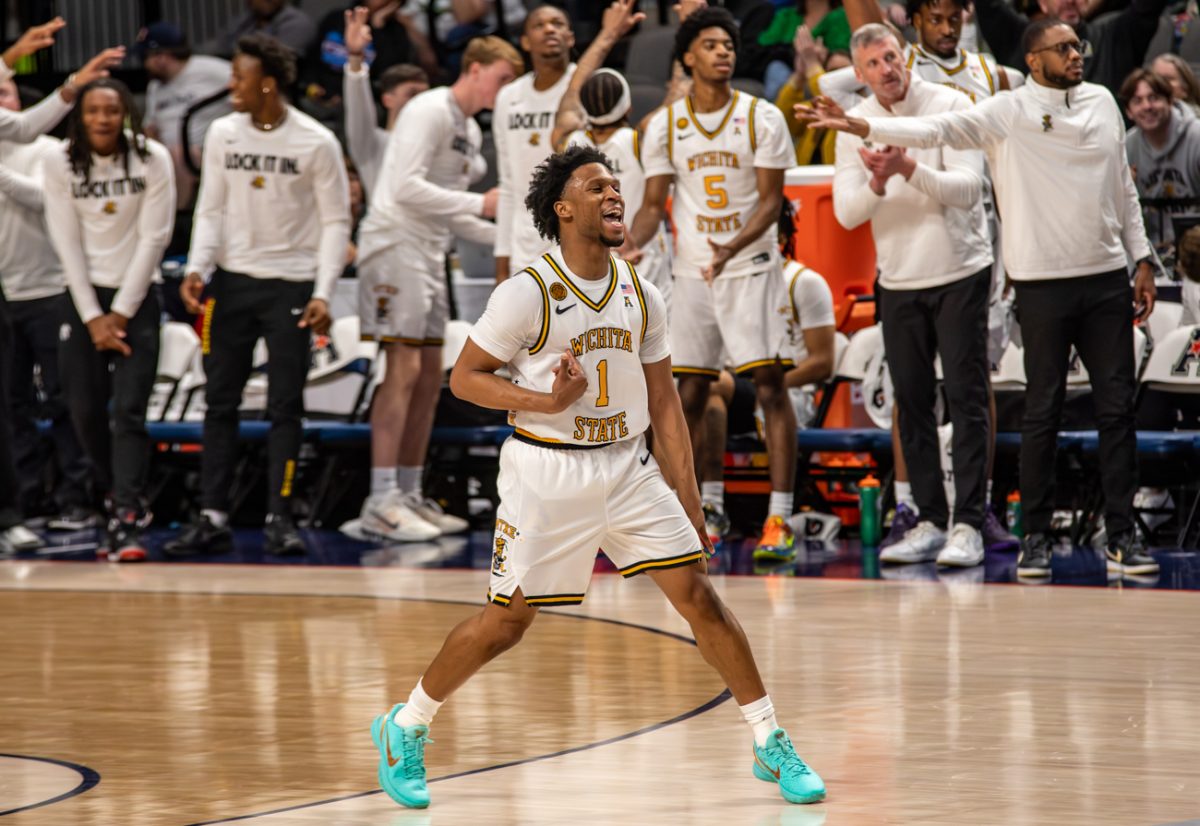 Wichita State men's basketball senior guard Kenyon Giles (1) celebrates a made 3-pointer against Tulsa on March 14 at Legacy Arena in Birmingham, Ala. Giles made 7-of-16 shots beyond the arc in the Shockers' 81-68 win.
