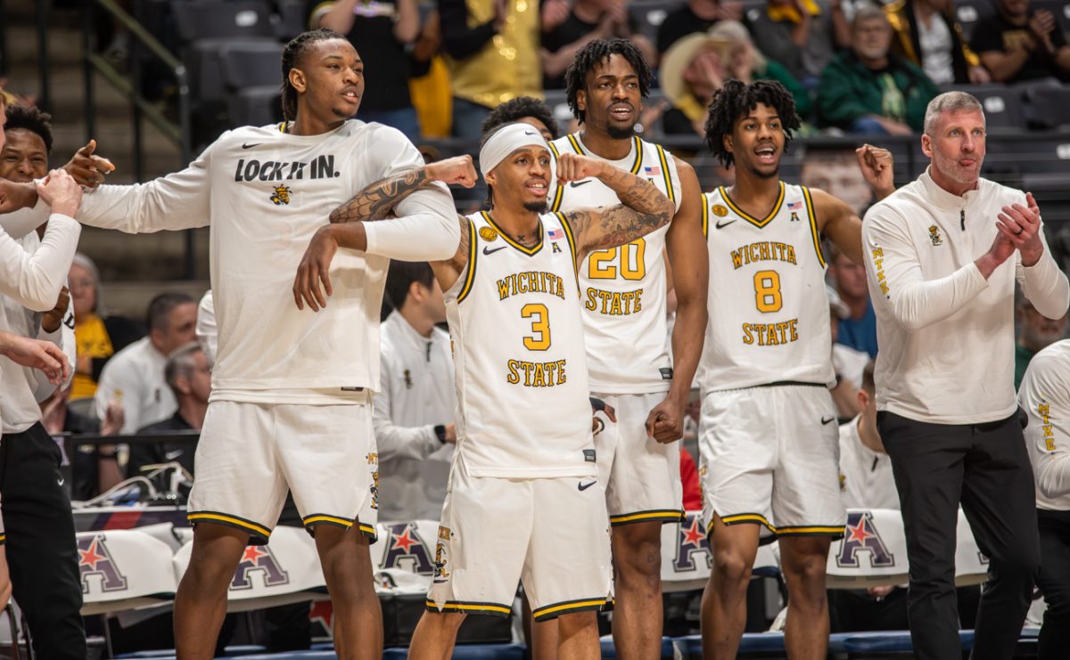 Wichita State men's basketball bench celebrates a play on March 14 at Legacy Arena in Birmingham, Ala. The Shockers beat the Golden Hurricane in the conference semifinals, 81-68.