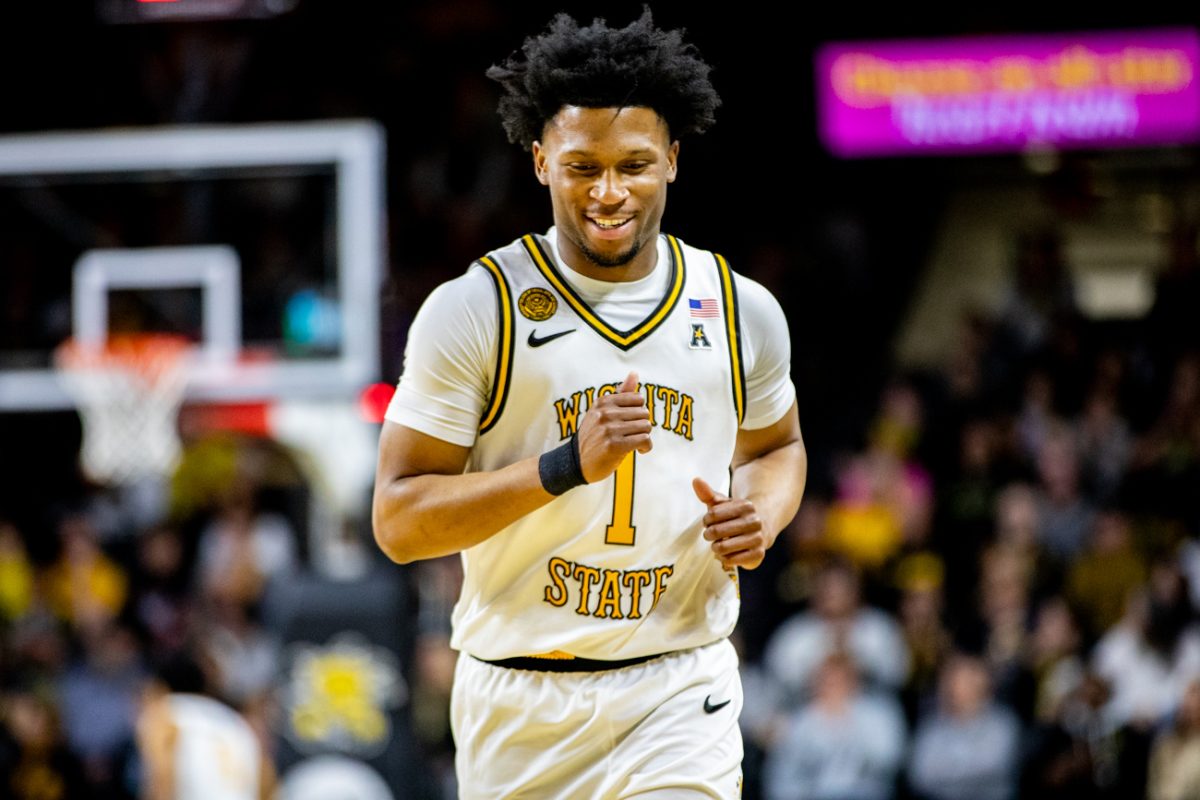 Wichita State men's basketball senior guard Kenyon Giles (1) laughs after a play against Temple on Feb. 21 at Koch Arena. (File photo)