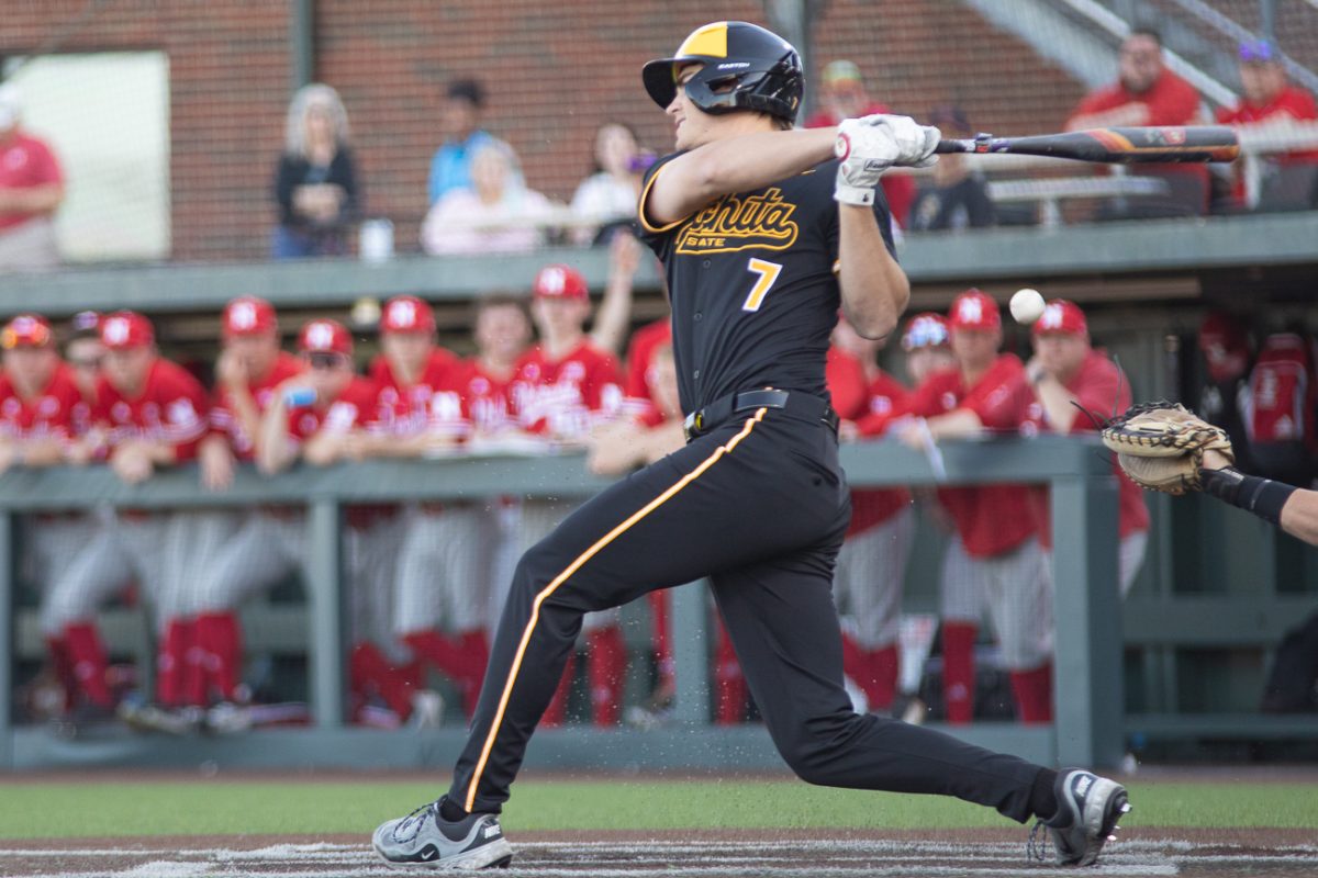 WSU baseball redshirt sophomore outfielder Josh Wulfert (7) swings and fouls a ball off to right in the ninth inning against Nebraska on March 18 at Eck Stadium. The Shockers lost both games of the series by a combined score of 18-2.