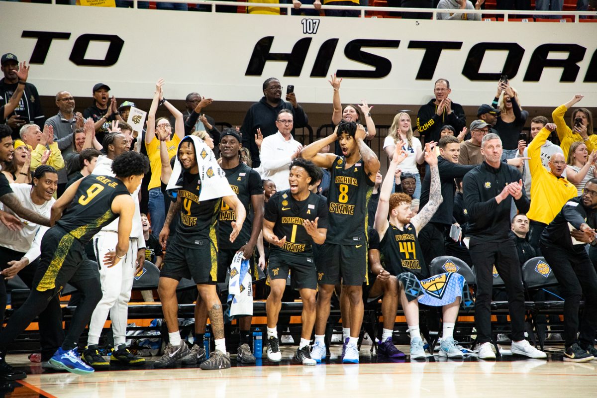 Wichita State's bench goes crazy over a 3-pointer by senior guard Mike Gray Jr. (9) on March 22 at Gallagher-Iba Arena in Stillwater, Okla. Gray scored 13 points for the Shockers during the 96-70 win.