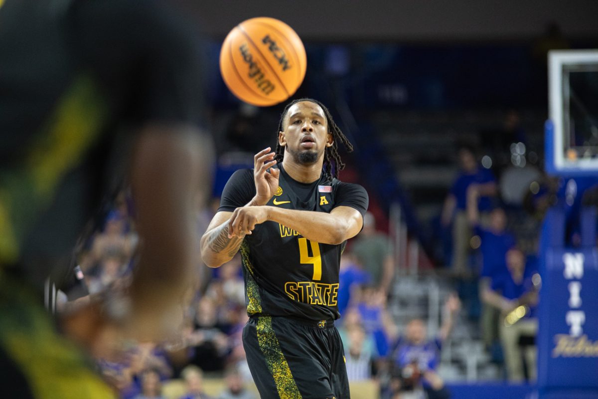 Wichita State men's basketball redshirt freshman forward TJ Williams (4) dishes a pass to a teammate on March 24 at the Reynolds Center in Tulsa, Okla. The Shockers lost to Tulsa in the quarterfinals of the NIT, 83-79.