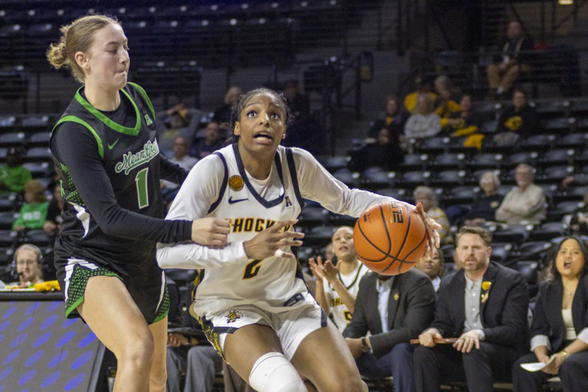 Wichita State women's basketball graduate guard Abby Cater (2) looks toward the basket on March 3 at Koch Arena. Cater scored a game-high 20 points in the win.