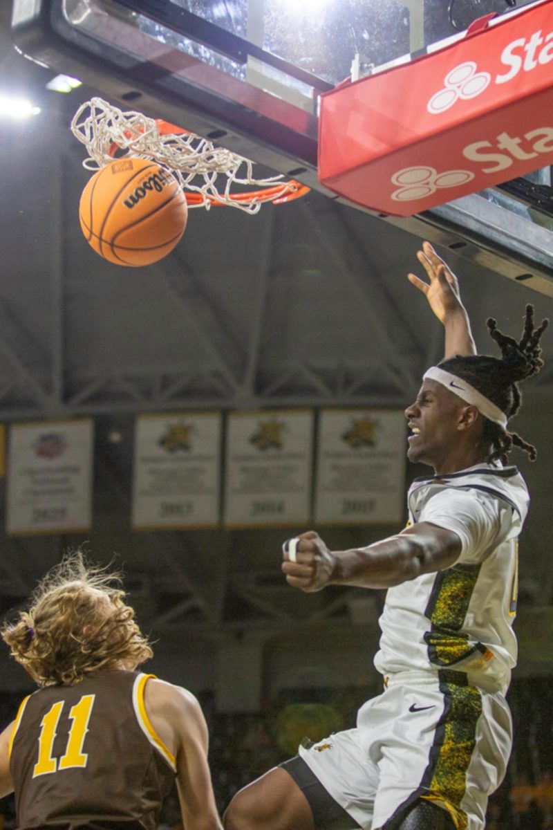 Wichita State men's basketball senior forward Karon Boyd (0) slams a one-handed dunk in the second half against Wyoming in the first round of the National Invitational Tournament March 17 at Koch Arena. The Shockers dunked it five times in the win.
