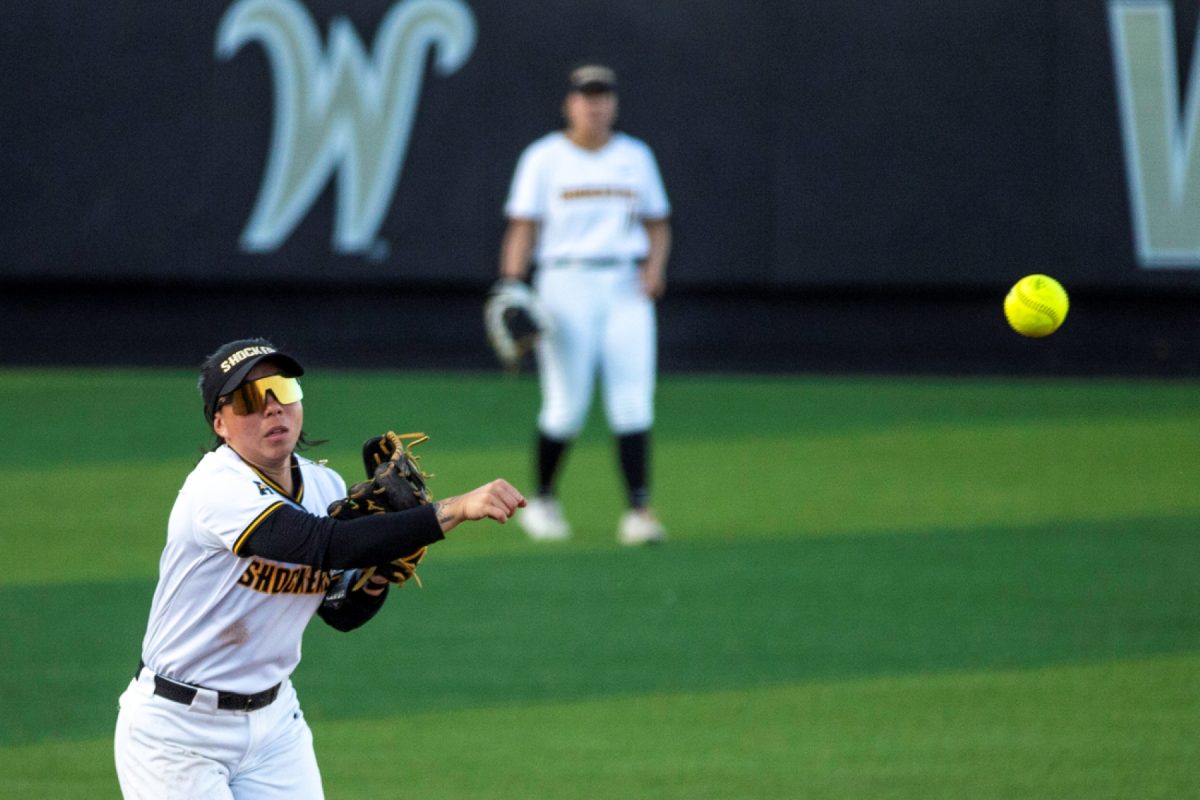 Wichita State softball senior infielder Chloe Rhine (1) fires one to first base against Florida Atlantic on March 20 at Wilkins Stadium. The Owls left 11 runners on base.