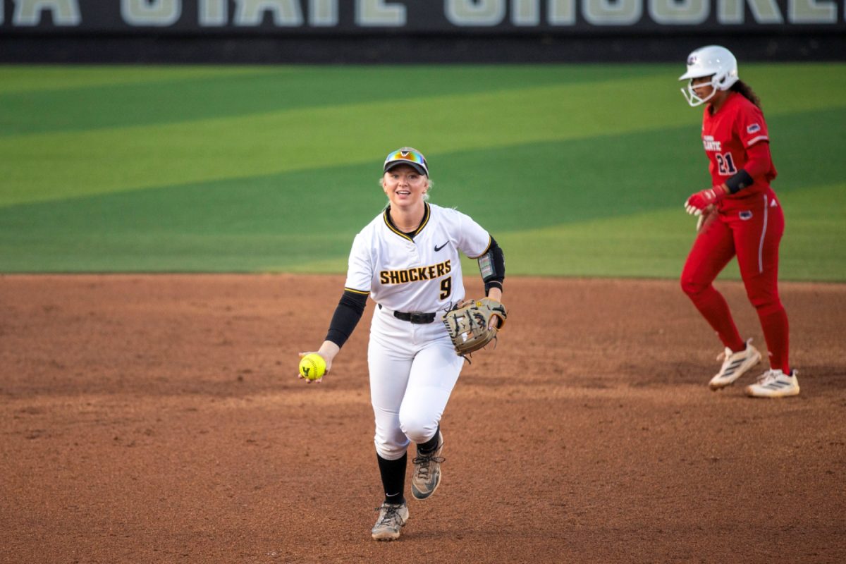 Wichita State softball freshman infielder Kammie Smith flips the ball to the pitching circle after the conclusion of an inning against Florida Atlantic on March 20 at Wilkins Stadium. The Shockers won, 3-2.