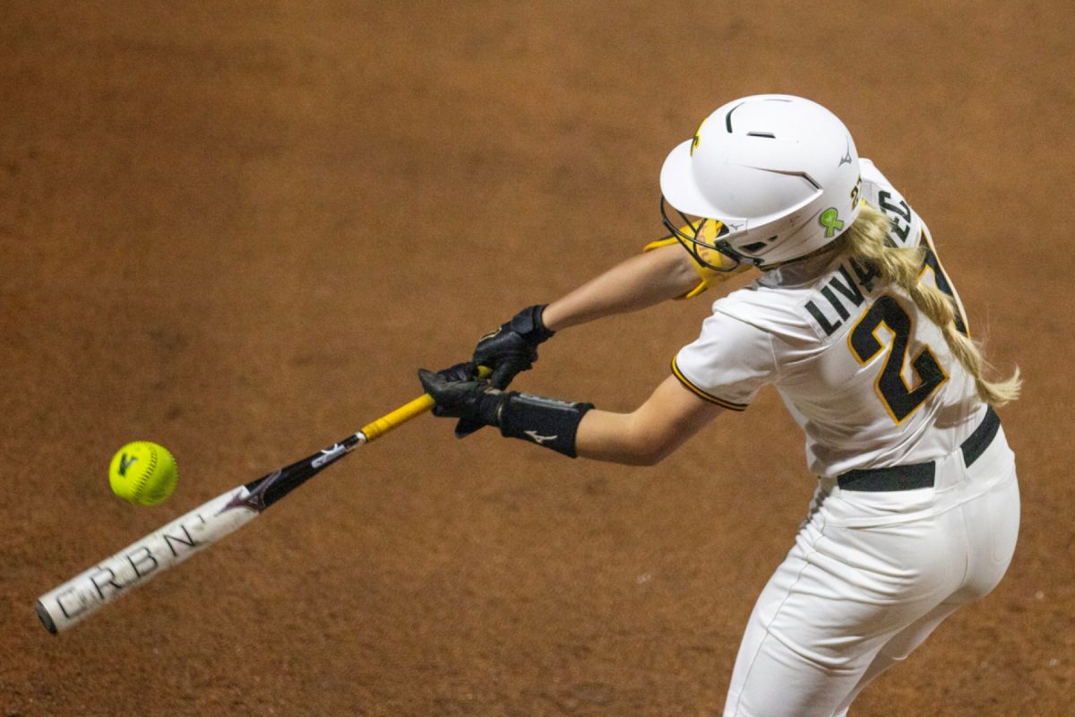 Wichita State softball sophomore outfielder Brookelyn Livanec (27) puts a barrel on the ball against Florida Atlantic on March 20 at Wilkins Stadium. Livanec went 0-1 in a pinch hit at bat during the game.