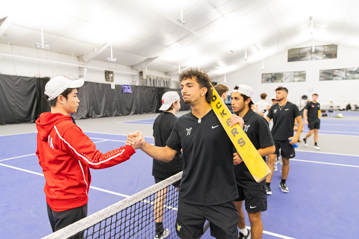 Wichita State men's tennis sophomore Ilias Worthington shakes hands with No. 52 Nebraska after their match on March 1 at Genesis Rock Road. The Shockers won 5-2.