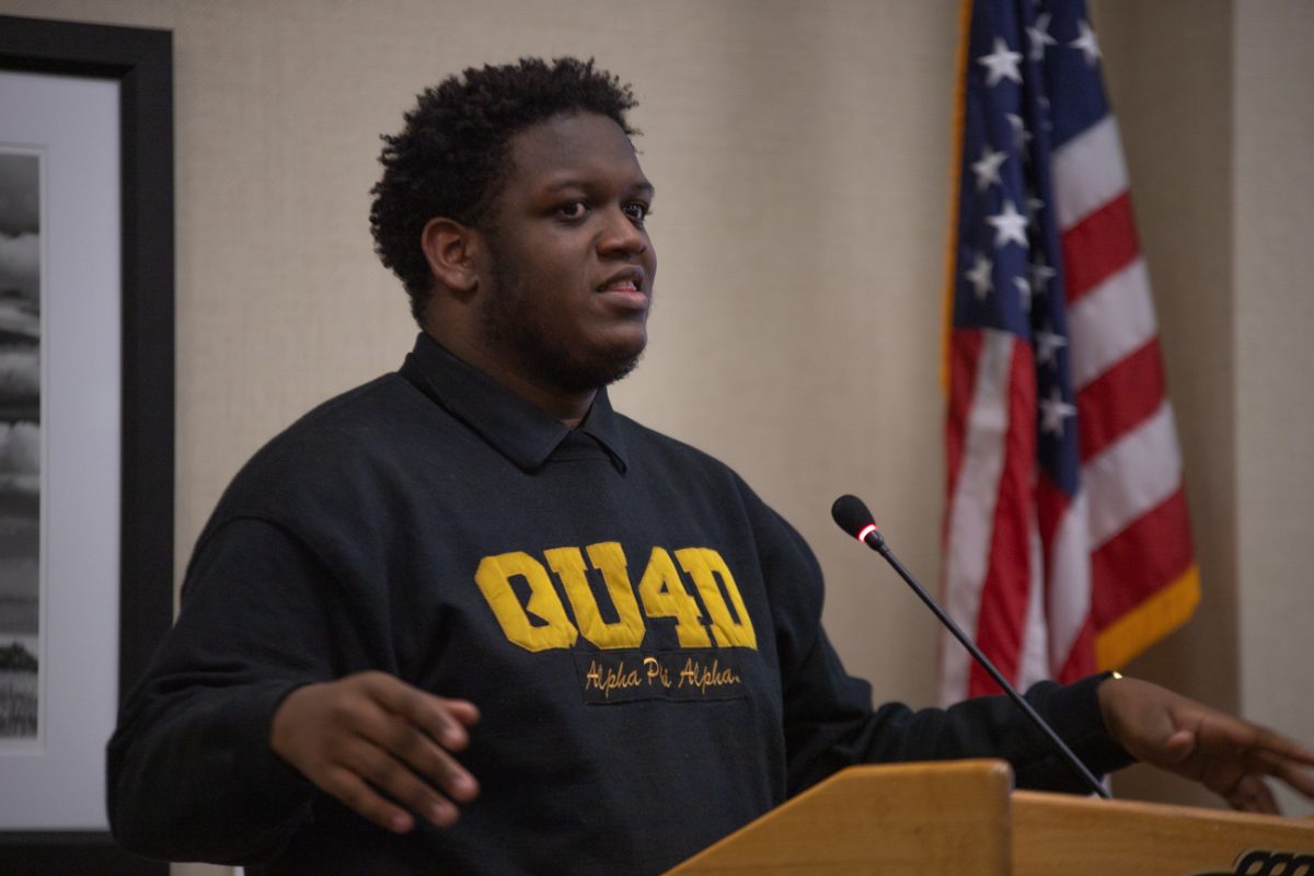 International Senator AJ Haynes presents a resolution on March 4 that recommends Wichita State recognize international holidays. The resolution passed at the Senate meeting.