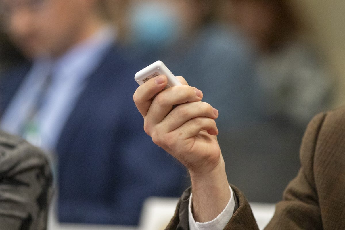 A student senator uses their clicker to vote on a piece of legislation. 