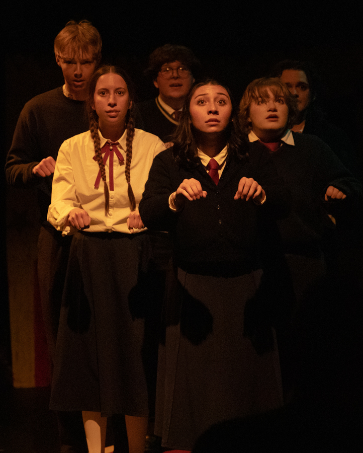 The cast of "Ride the Cyclone" look toward the crowd during the final moments of the play.