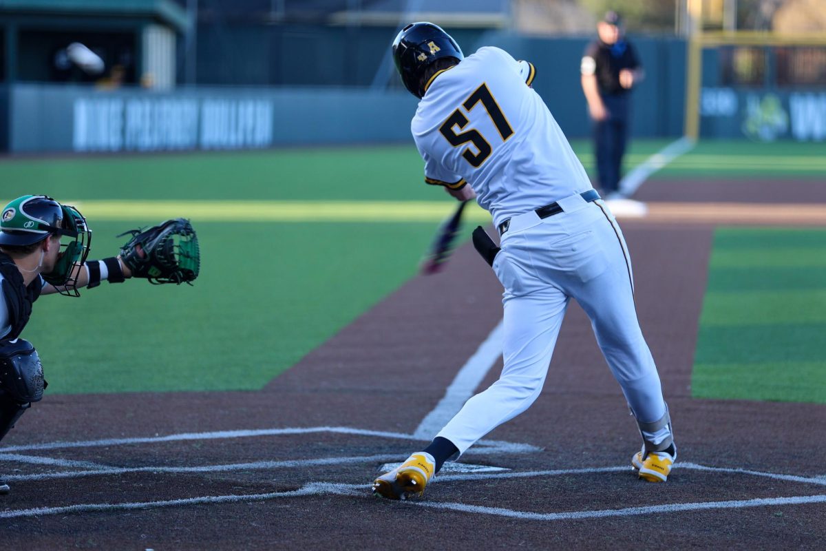 Wichita State baseball junior infielder MJ Sweeney (57) fouls a ball off against Charlotte on March 20 at Eck Stadium. Sweeney has hit .294 through the Shockers' first 24 games this season.