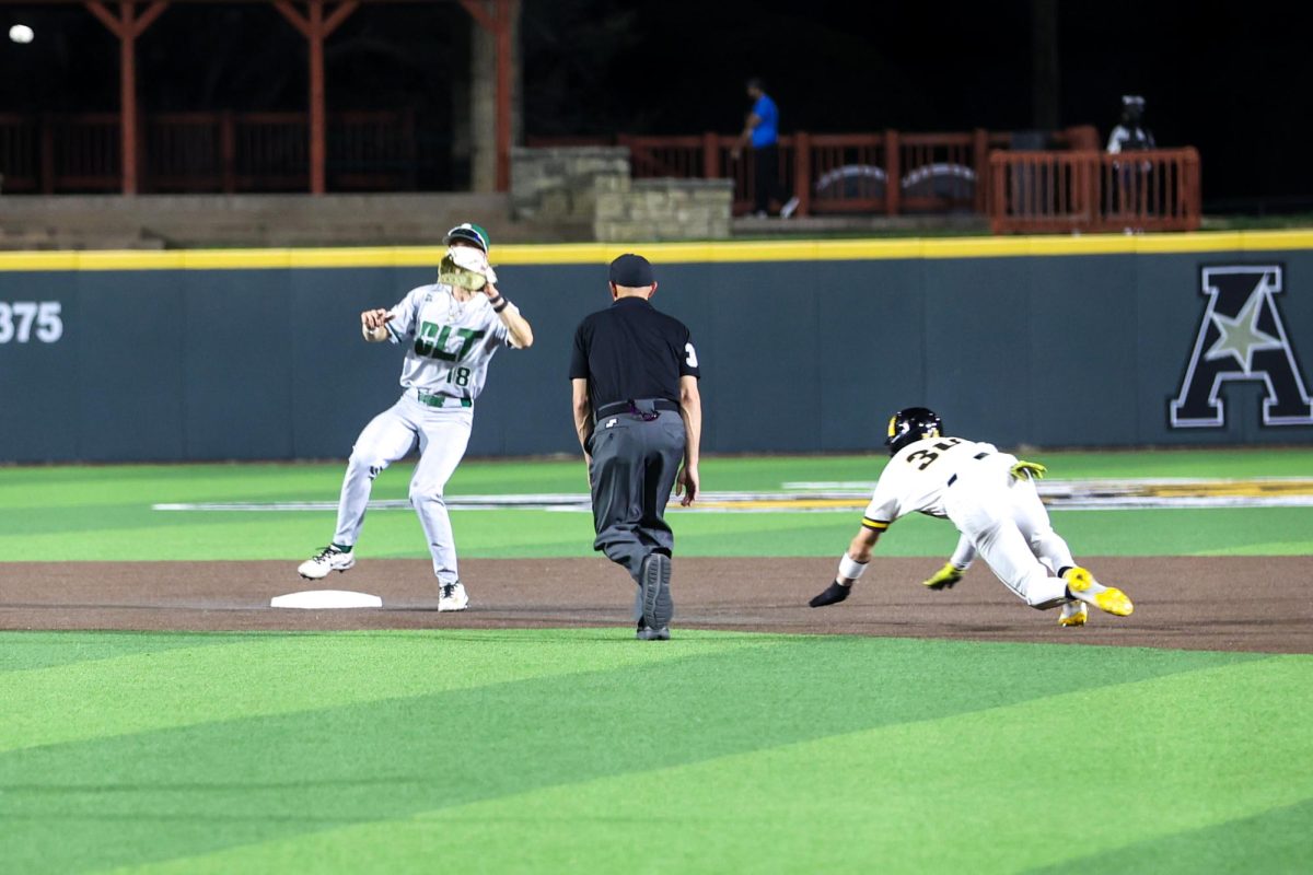 Wichita State baseball junior outfielder Anthony Cepeda (30) slides into second base against Charlotte on March 20 at Eck Stadium. Cepeda stole two bases in the Shockers' 8-3 win.