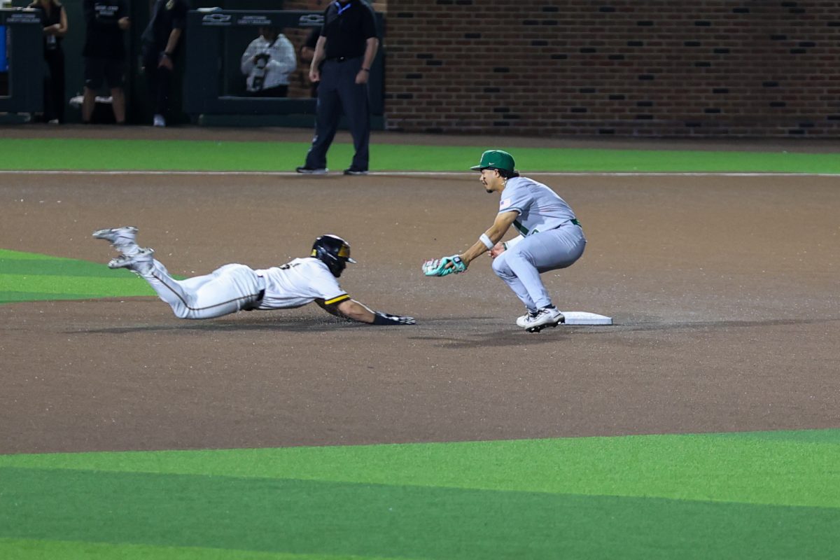 Wichita State baseball graduate infielder Alex Ulloa (8) steals second base against Charlotte on March 20 at Eck Stadium. The Shockers stole four bases in the win.