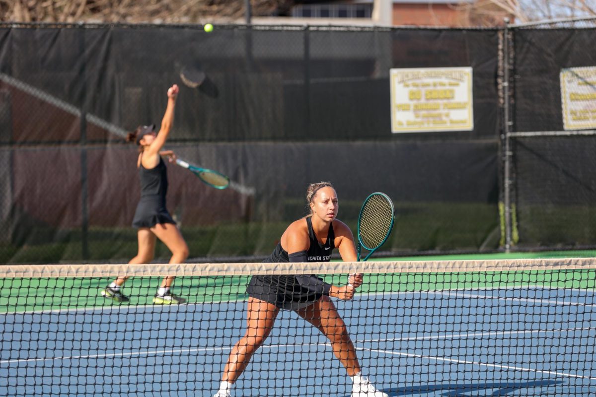 Wichita State women's tennis senior Kristina Kudryavtseva waits for senior Theodora Chantava's serve during doubles against South Florida March 27 at the Sheldon Coleman Tennis Complex. Kudryavtseva and Chantava won the match, 6-4.