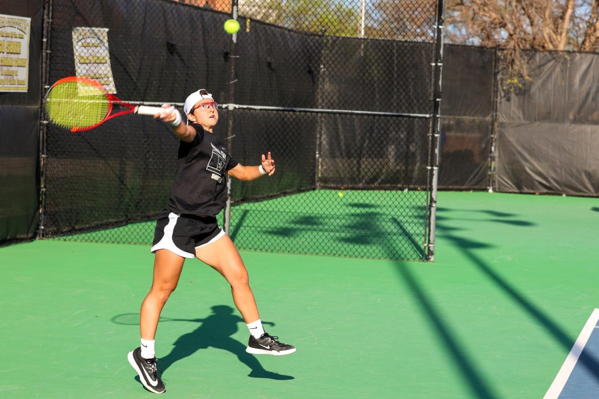 Wichita State women's tennis junior Giorgia Roselli elevates to make a hit against South Florida March 27 at the Sheldon Coleman Tennis Complex. The Shockers won, 4-0.