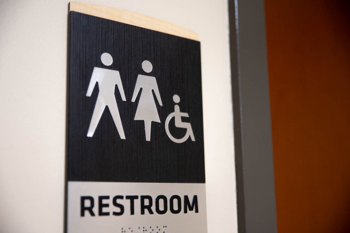 A sign outside the single-occupancy bathroom on the second floor of the Rhatigan Student Center. Under Kansas' new law, multi-stall restrooms must be single-sex, and people are restricted to use facilities based on their sex as recorded at birth. 
