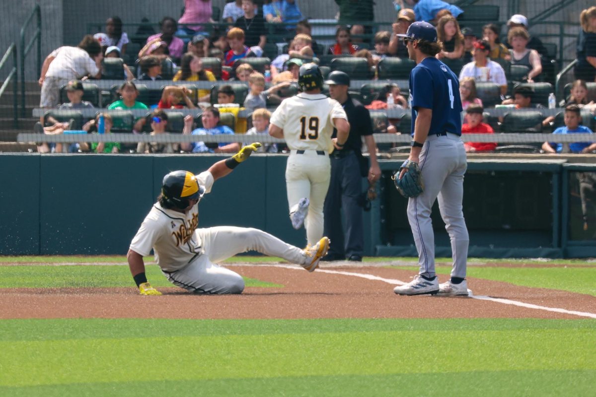 Wichita State baseball senior outfielder Jacob Gutierrez (27) slides into third base against Washburn March 31 at Eck Stadium. Gutierrez hit 2-for-5 and scored a run against the Ichabods.