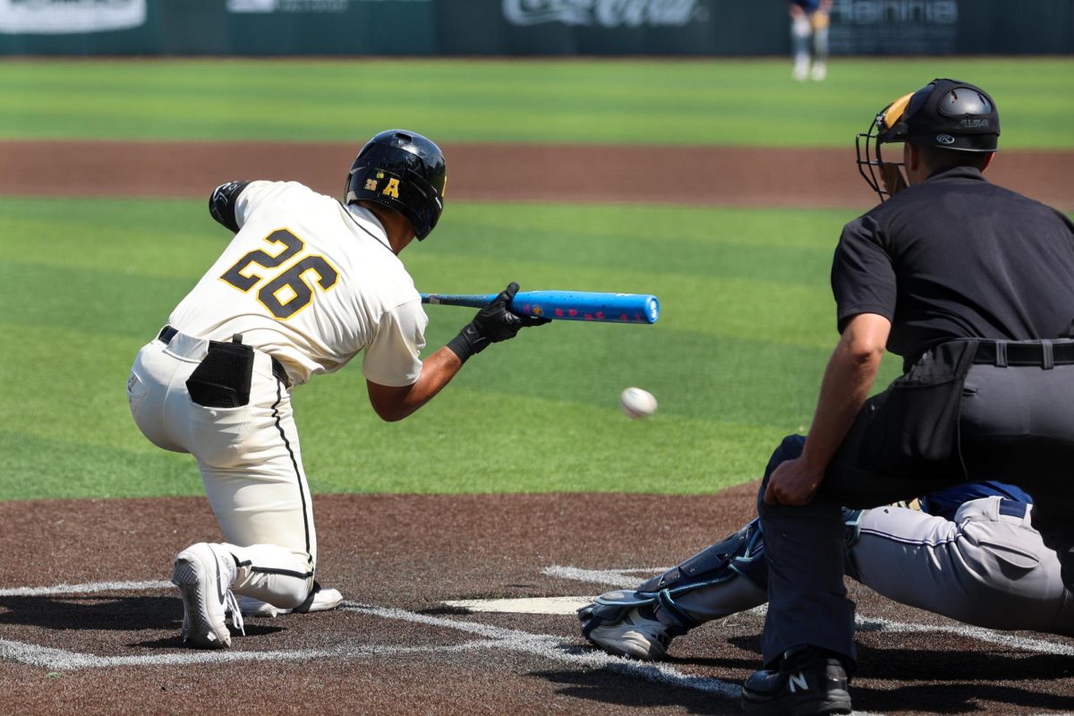 Wichita State baseball junior outfielder Kaleb Duncan (26) pulls back on a bunt attempt against Washburn March 31 at Eck Stadium. Duncan went 0-for-5 at the plate.