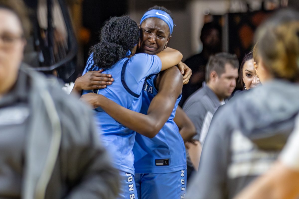 Columbia women's basketball guard Perri Page (1) and forward Susie Rafiu (0) embrace each other and share a moment after the Lions' 81-64 win against BYU in the WBIT championship game on April 1 at Koch Arena. Columbia led as many as 27 points during the game.