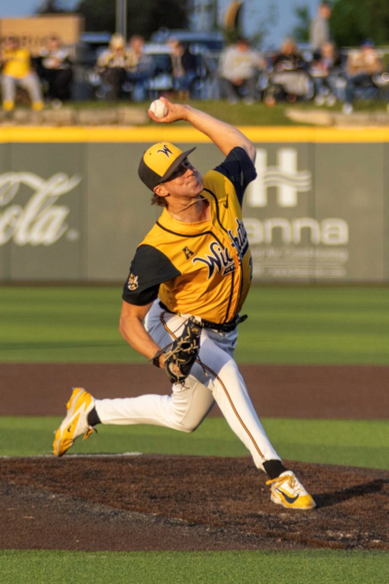 Wichita State baseball senior pitcher Brady Owens (28) delivers to a Kansas Jayhawk on April 28 at Eck Stadium. The Shockers' pitching staff allowed 14 runs, 12 earned, against No. 11-ranked KU.