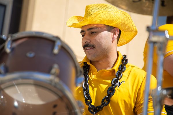 Rafael Guereque focuses on keeping rhythm on drums for the Shocker Sound Machine as they help send off the Wichita State men's basketball team before the semifinals of the American Conference Championship on March 14 in Birmingham, Ala. (File photo)