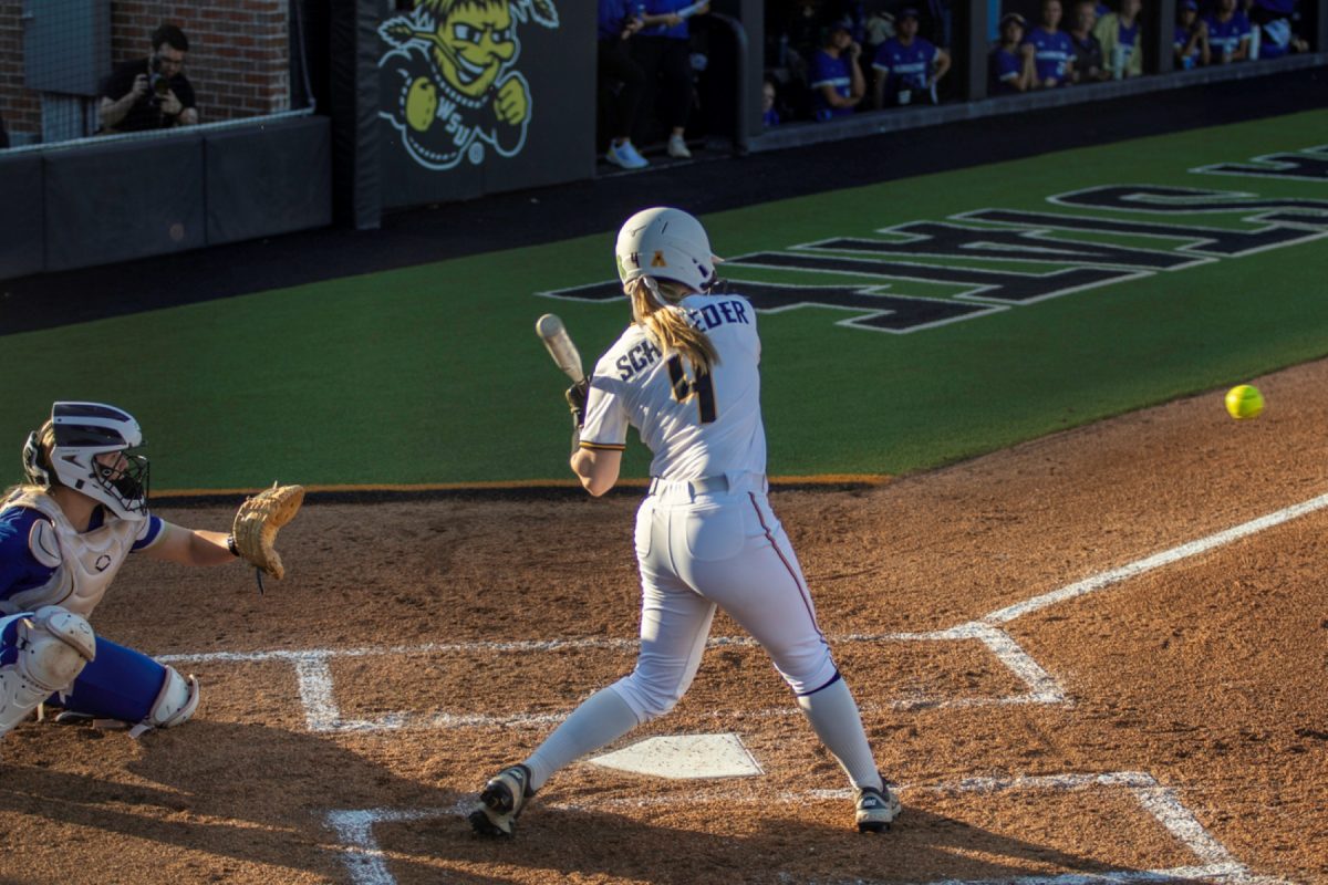 Wichita State softball graduate student Johnna Schroeder (4) begins her swing against Tulsa on April 2 at Wilkins Stadium. The Shockers made 10 hits in the 11-10 loss.