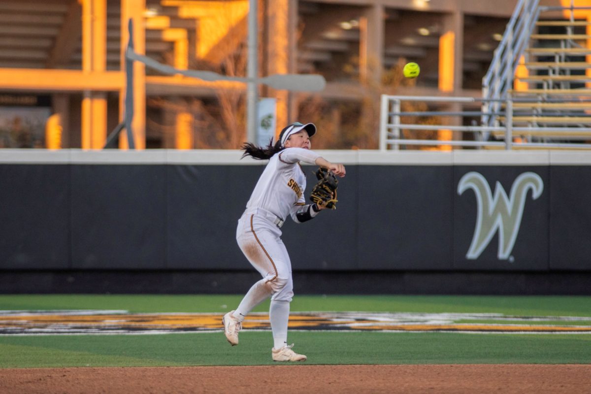 Wichita State softball senior Chloe Rhine (1) rifles the ball from short stop against Tulsa on April 2 at Wilkins Stadium. Rhine ended the game with two put outs and an assist on defense.