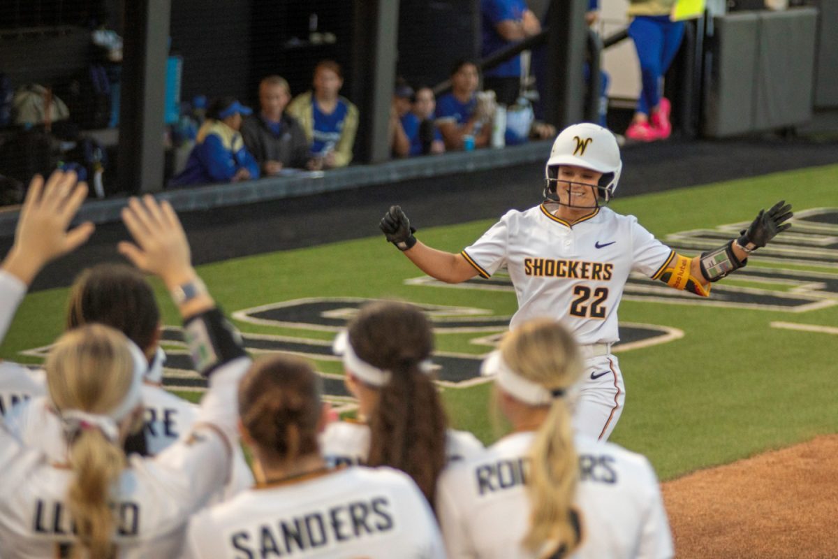 Wichita State softball senior Jodie Epperson (22) smiles before crossing home plate after hitting a home run against Tulsa on April 2 at Wilkins Stadium. (File photo)