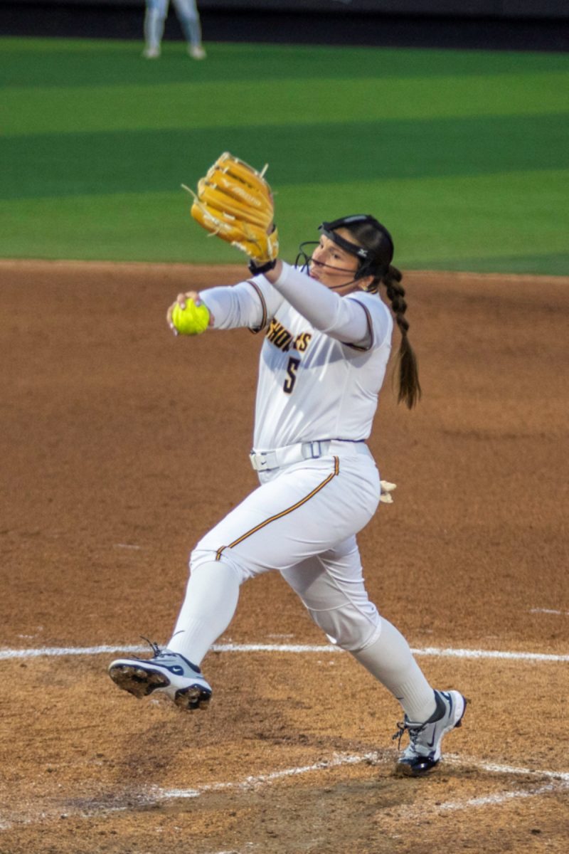 Wichita State softball sophomore Ava Sliger (5) pitches to a Tulsa batter on April 2 at Wilkins Stadium. Sliger pitched the final two innings of the Shockers' 11-10 loss.