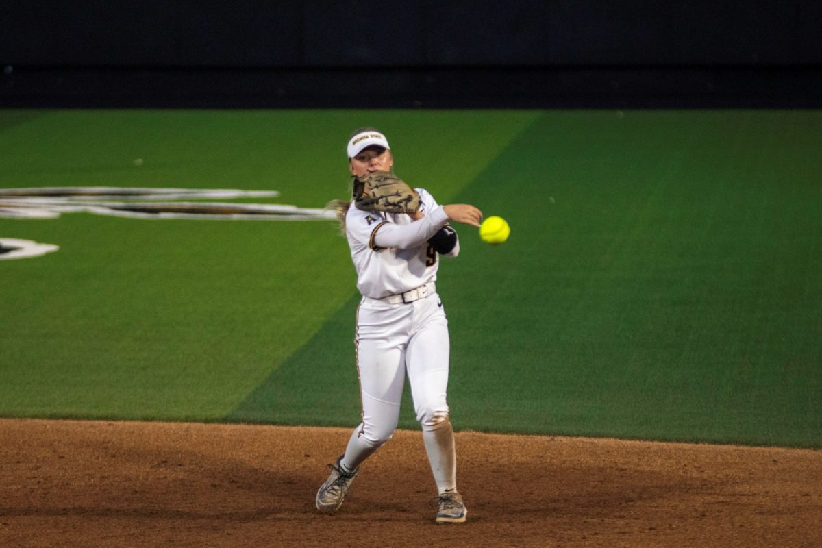 Wichita State softball freshman Kammie Smith (9) throws the ball to first base against Tulsa on April 2 at Wilkins Stadium. Smith hit 1-for-4 against the Golden Hurricane.