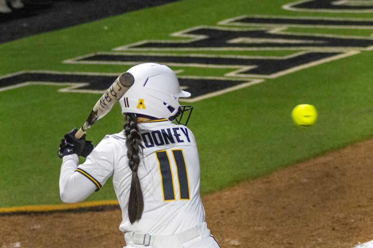 Wichita State softball freshman outfielder Mackenzie Rooney (11) watches a pitch against Kansas on March 4 at Wilkins Stadium. (File photo)
