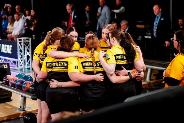 The Wichita State women's bowling team huddles during the national championship best-of-seven against Jacksonville State on April 11 at Yorktown Lanes in Parma Heights, Ohio. (Photo courtesy of Bryan Chavez / Wichita State Athletics)