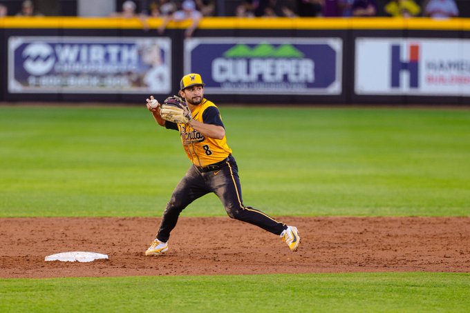 Wichita State baseball graduate infielder Alex Ulloa (8) throws to first base against East Carolina April 17 at Clark-LeClair Stadium in Greenville, N.C. (Photo courtesy of Wichita State Athletics)