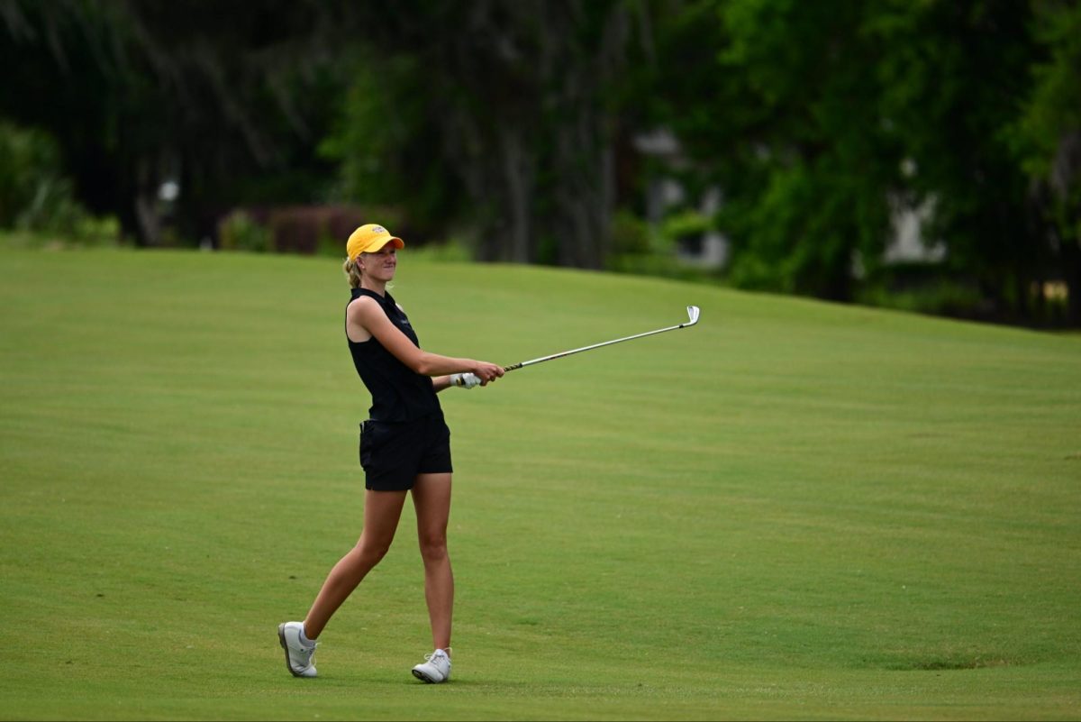 Wichita State women's golf senior Kate Tilma watches the ball flight during the American Conference Championship at the Southern Hills Plantation Club in Brooksville, Fla. (Photo courtesy of Wichita State Athletics)
