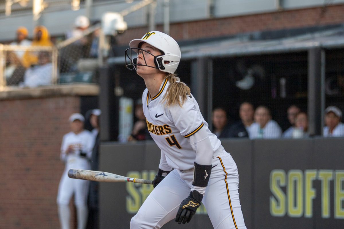 Wichita State softball graduate student Johnna Schroeder (4) watches a fly ball she hit against UAB on March 13 at Wilkins Stadium. (File photo)