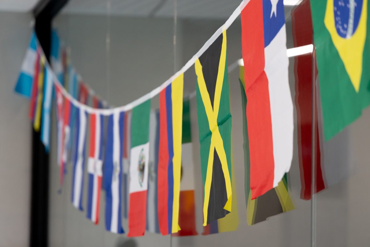 Flags representing various countries hang in the Hispanic Serving Office housed in the Shocker Success Center.